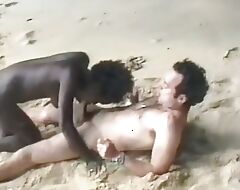 Sexy French ebony gets her tits sprayed more than the beach