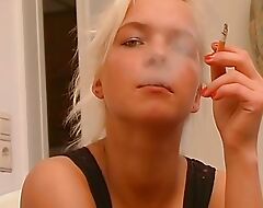 Stunning looking German blonde adores smokin' while taking a cock gaping void