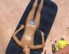 Girl caught sunbathing topless