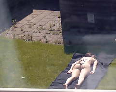 Sunbathing (Partly Topless)