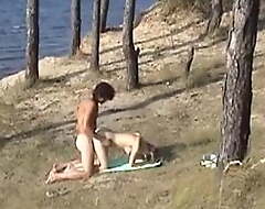 Hot nude couple bonking on transmitted to desolate river bank