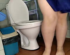 Chubby wife pissing on the toilet