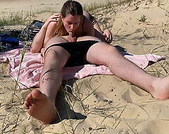 Nudist couple loving blowjob convenient the beach