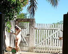 Nudist housewife on the street together with with the front yard