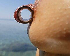 nippleringlover - horny milf pissing on the nude beach, pierced pussy, wide open, distinguished pierced nipples